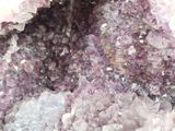 a close up view of a cluster of purple crystals