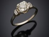 an old cut diamond ring with a single stone in the center