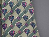 a green tie with hot air balloons on it