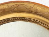 a mirror that is sitting on the wall in the room