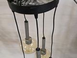 a picture of a lamp that is hanging from a ceiling