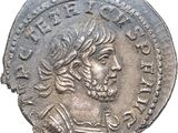 Gros plan sur une pièce de monnaie portant le visage d'un homme