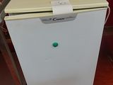 an image of a small white refrigerator in a kitchen