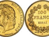 a gold coin with the image of a man ' s head on it