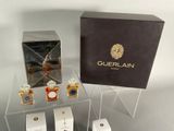 a lot of perfumes that are sitting on a table