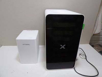 a white box and a black box sitting on a table