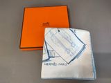 an orange box and a white handkerchief with a picture of a car on it