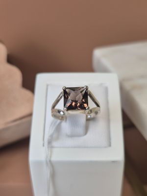 a ring that is sitting in a box on a table