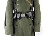 uniform of a soldier with a gun on a mannequin stand