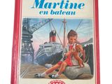 an old children ' s book with a picture of a girl and a dog