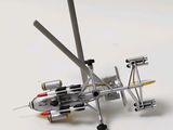 a model of a plane with a propeller on a white surface
