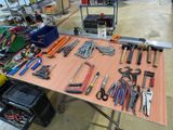 a table with many tools on it in a room