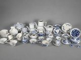 an assortment of blue and white porcelain dishes and cups and saucers