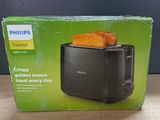 philips toaster box with two pieces of toast on top of it