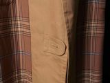 a close up of a jacket and tie on a mannequin mannequin mannequin mannequin mannequin mannequin manne