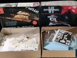 two boxes that have some items inside of them