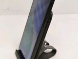 a cell phone that is sitting on a stand