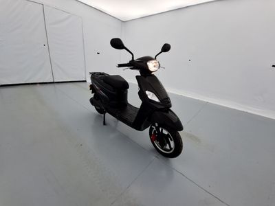 a scooter that is parked in a room