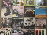 the beatles album covers are displayed on a wall in a room