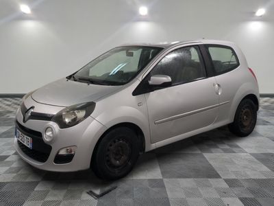 a picture of a small silver car parked in a garage