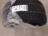 a close up of a tire on the ground with a plastic wrap around it