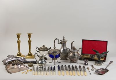 a lot of silverware on a table with a red box