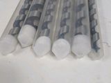 six clear plastic tubes are lined up on a white surface
