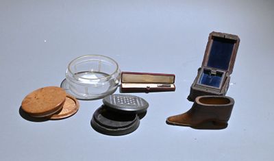 a cell phone, a glass of water, a cookie, and a glass of water