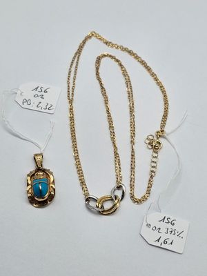 two gold and turquoise stone pendants and a gold chain