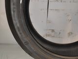 a close up of a tire tire on a white surface