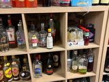 many bottles of alcohol on the shelves in the room