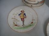 a plate with a picture of a man and a dog on it