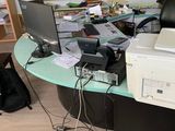 a desk with a computer and a printer on it
