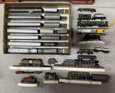 a box with a bunch of different model trains in it