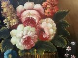 a painting of flowers in a basket on a table