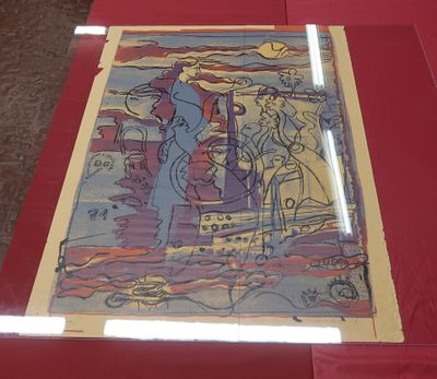 a picture of a painting on a table with a red cloth