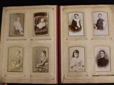 an old photo of a person holding a book with a bunch of pictures on it