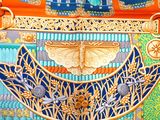 an image of a painting of a woman in a blue and orange dress
