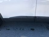 a close up of a car ' s tire on the road