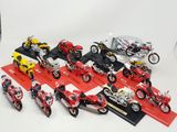 a lot of motorcycles that are on display on a table