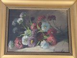 a picture of a painting of flowers in a gold frame