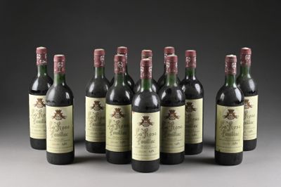 six bouteilles de vin sont alignées sur une surface grise