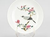 an image of a plate with a bird and flowers painted on it