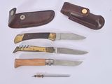 five different types of knives on a white surface