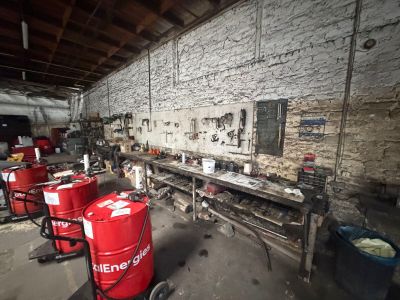 a room with a lot of red barrels and other items