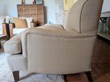 a chair that is sitting in the middle of a living room