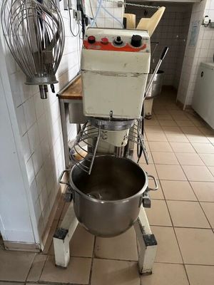 an image of a kitchen with a mixer and a mixer bowl