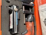 an orange case with tools in it on a table