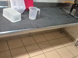a kitchen with a sink, stove, and a counter top