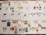 a lot of postcards on the floor of this room